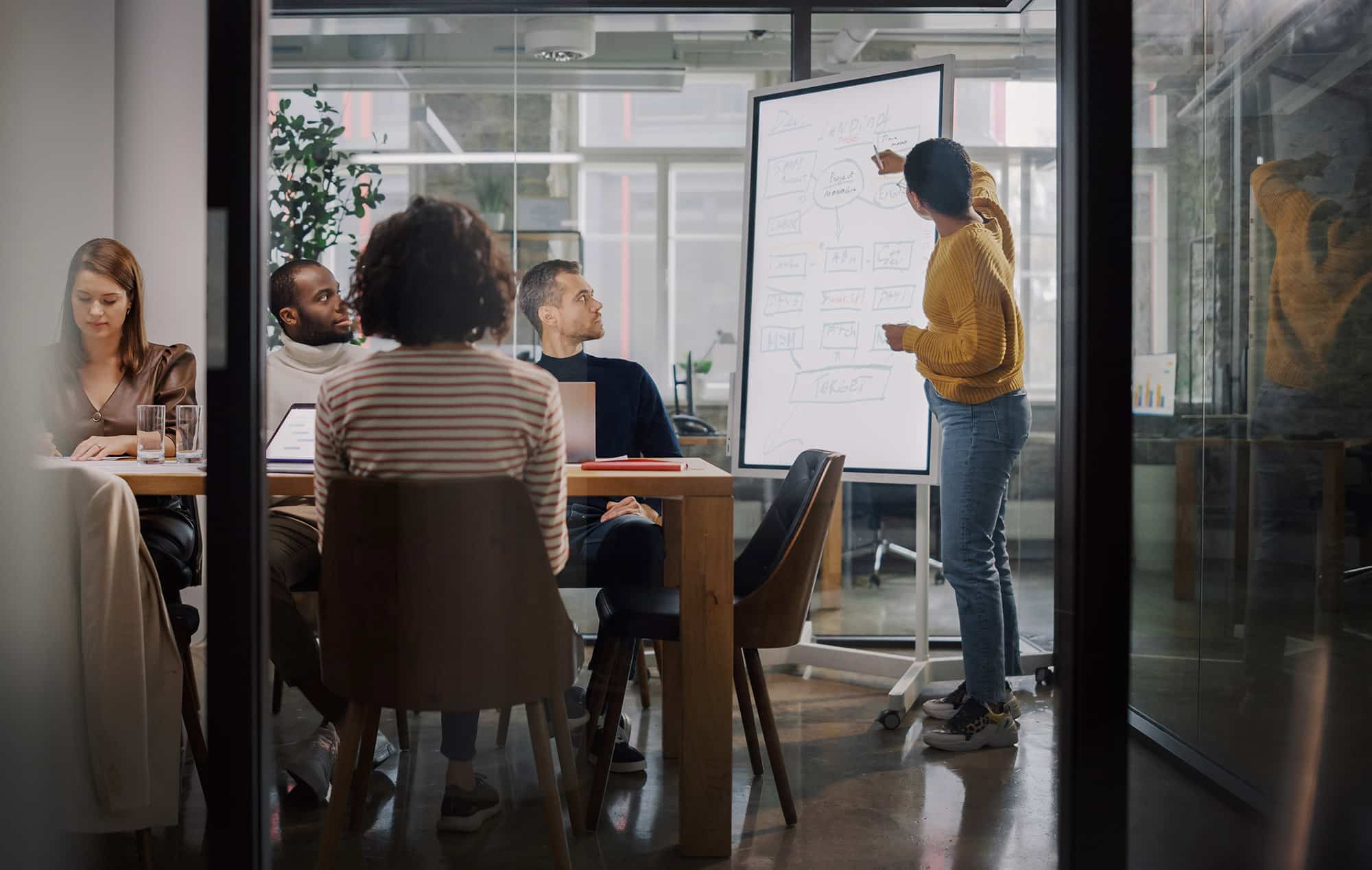 project manager makes a presentation for a young diverse creativ